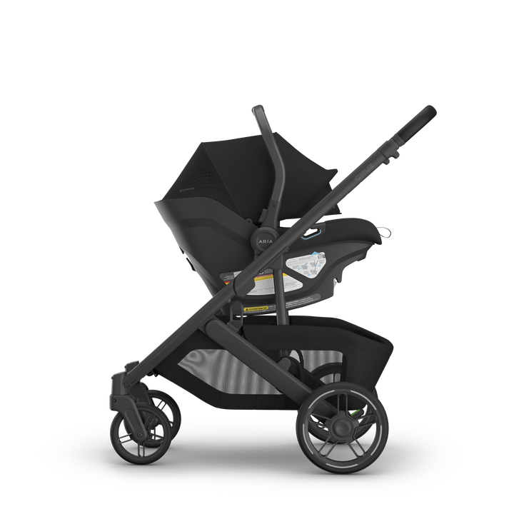 Aria V2 James Black on Cruz V3 side view — UPPAbaby all-black infant seat compact stroller system