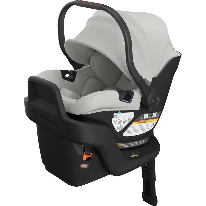 Three-quarter left angle of the Uppababy Aria V2 Infant Car Seat in Savannah, blending soft tones with modern comfort.
