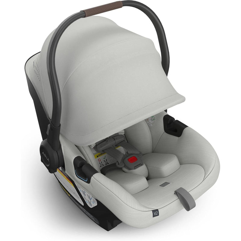 Three-quarter right view of the Uppababy Aria V2 Infant Car Seat in Savannah highlights its modern silhouette and premium design.