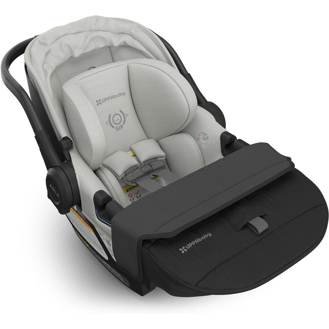 Uppababy Aria V2 Infant Car Seat in Savannah displayed with folded foot cover, crafted for easy travel and baby comfort.