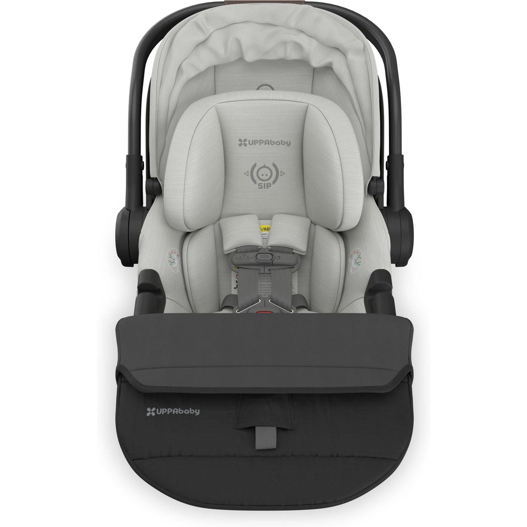 From above, the Uppababy Aria V2 in Savannah with folded foot cover presents a sleek, portable baby car seat option.