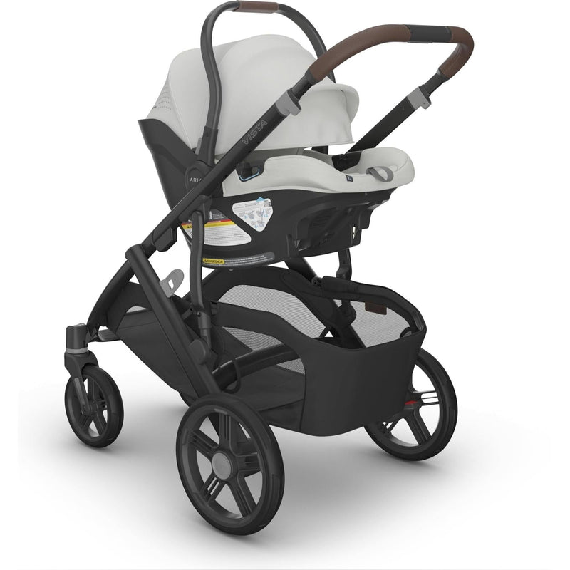 Side angle of the Uppababy Aria V2 in Savannah mounted on Vista stroller, the best car seat for newborns and travel.