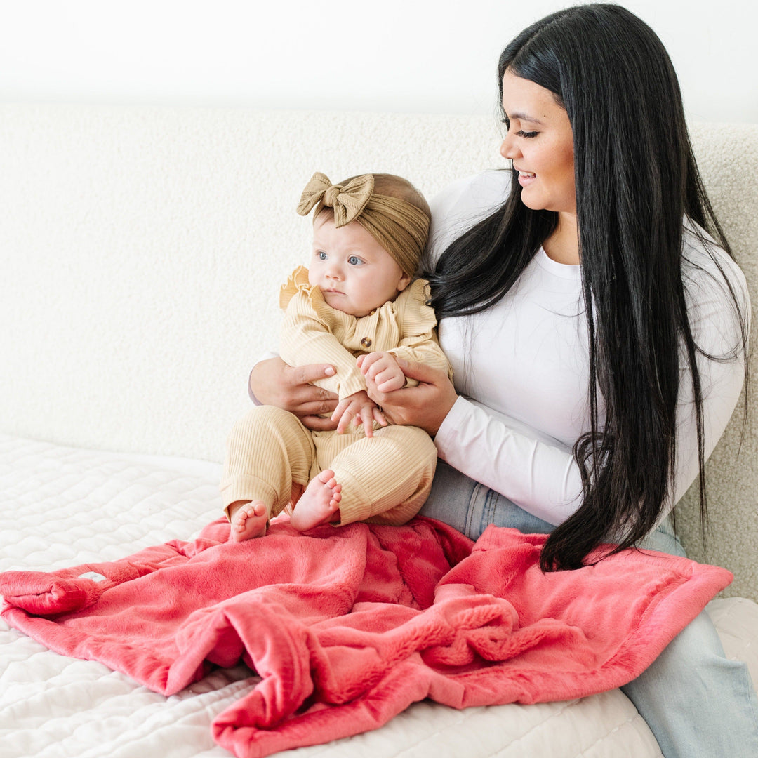 The Primrose Lush Receiving Blanket from Saranoni is perfect for naps, a soft soft baby blankets pick.