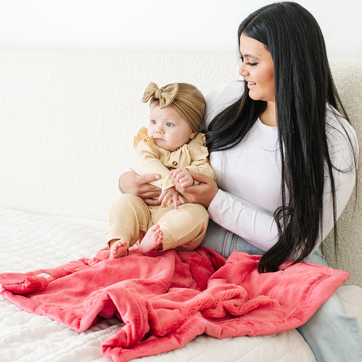 The Primrose Lush Receiving Blanket from Saranoni is perfect for naps, a soft soft baby blankets pick.