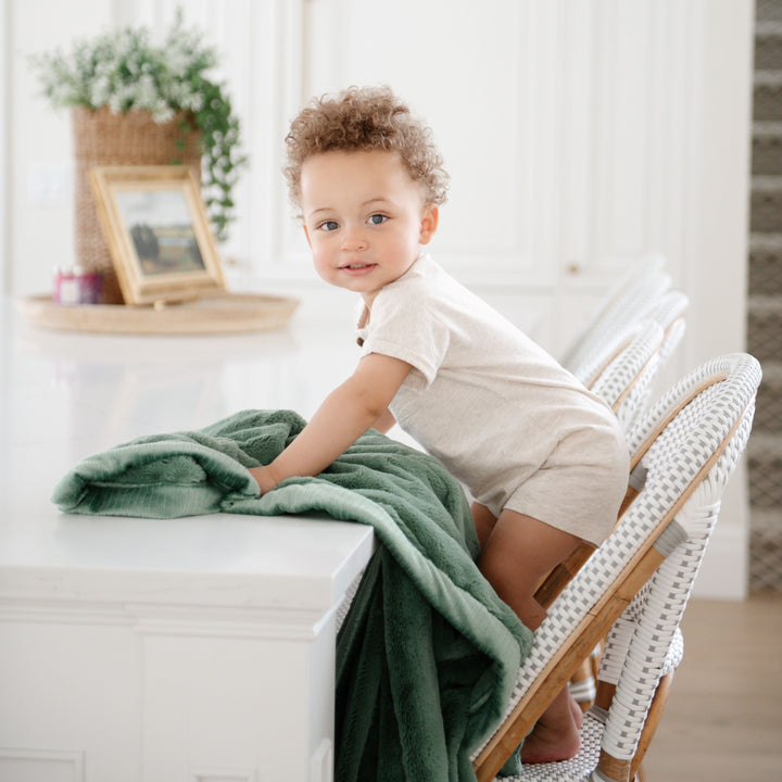 Snuggle moments are sweeter with Seagrass Lush Receiving Blanket by Saranoni, a top best baby blanket.