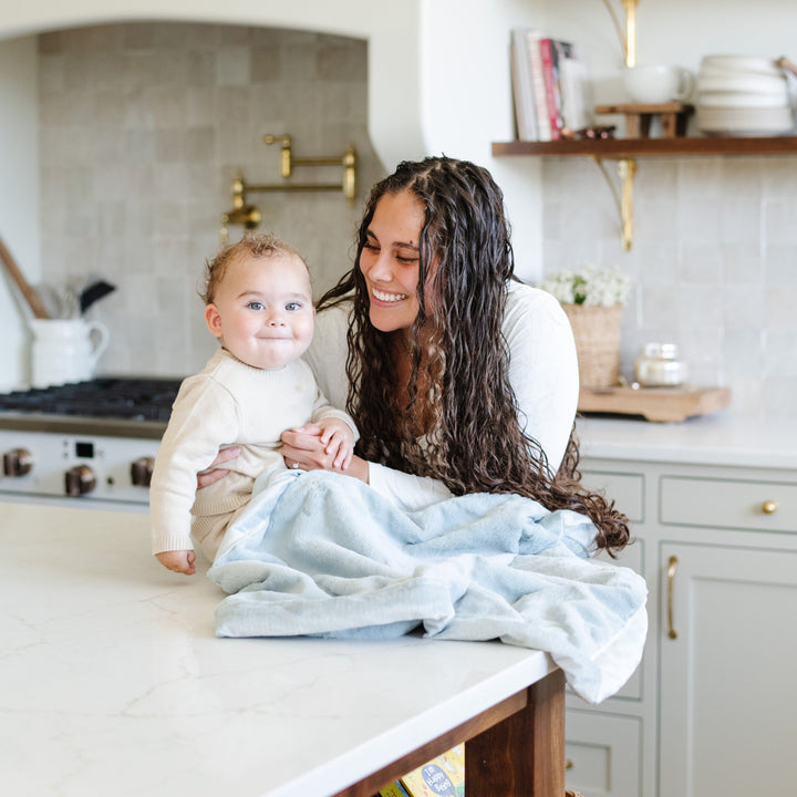 The Chambray Saranoni Lush Receiving Blanket provides comfort and warmth, a gentle baby receiving blankets.