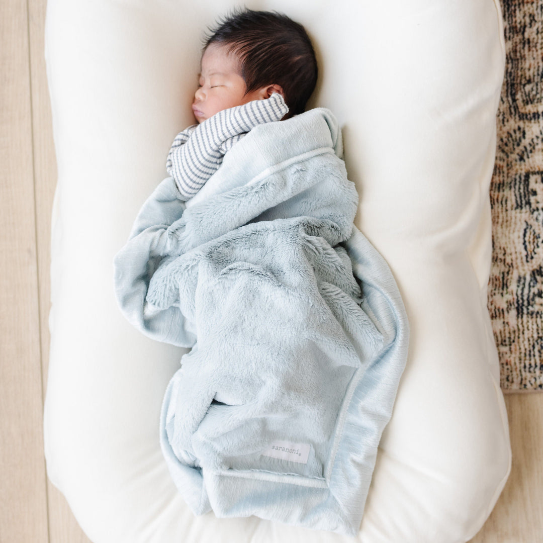Saranoni Lush Mini Blanket in Chambray delivers plush cozy softness, making it a soft baby blankets favorite.