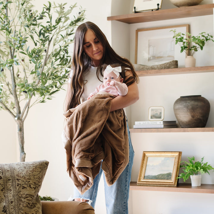 Cuddle in comfort with Hazlenut Saranoni Lush Receiving Blanket, perfect as a baby blankets for everyday use.