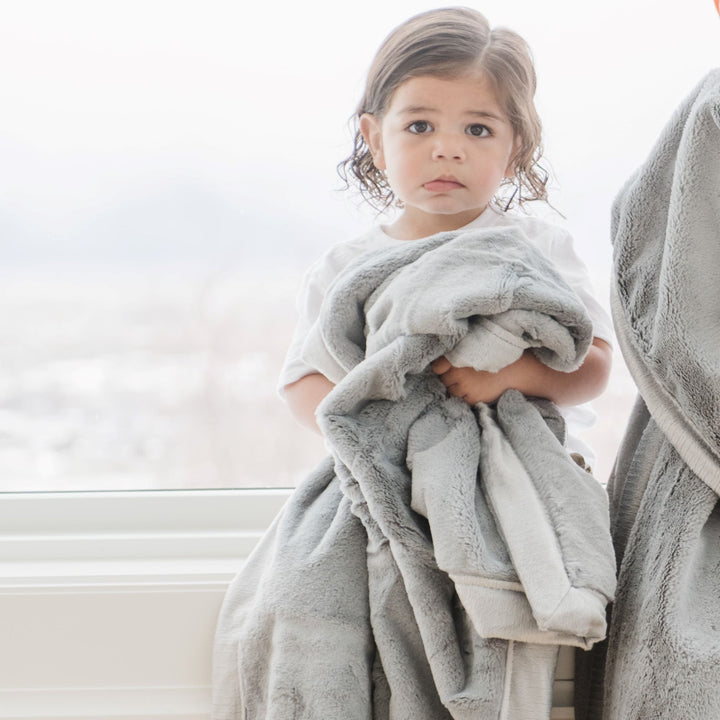 Infants stay snug with Gray Lush Receiving Blanket by Saranoni, ideal among best toddler blankets.