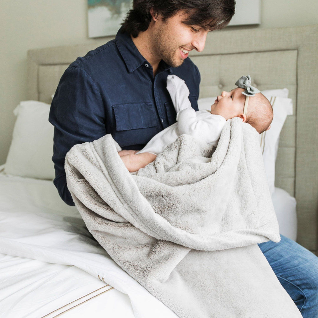 Wrap your little one in the soft Feather Lush Receiving Blanket by Saranoni, perfect for baby blanket snuggles.