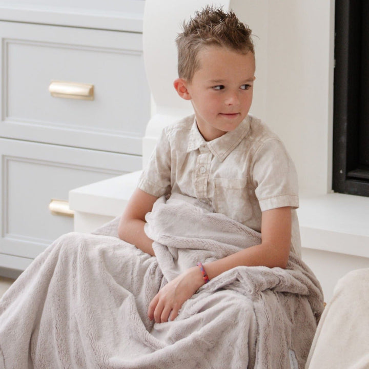 The Feather Saranoni Lush Toddler Blanket creates elevated softness and warmth, making it a perfect baby blanket pick.