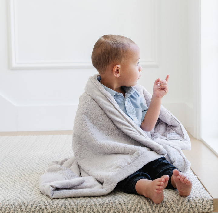 Gentle Feather Saranoni Lush Receiving Blanket ensures infants stay cozy, a favorite among best blankets for toddlers.