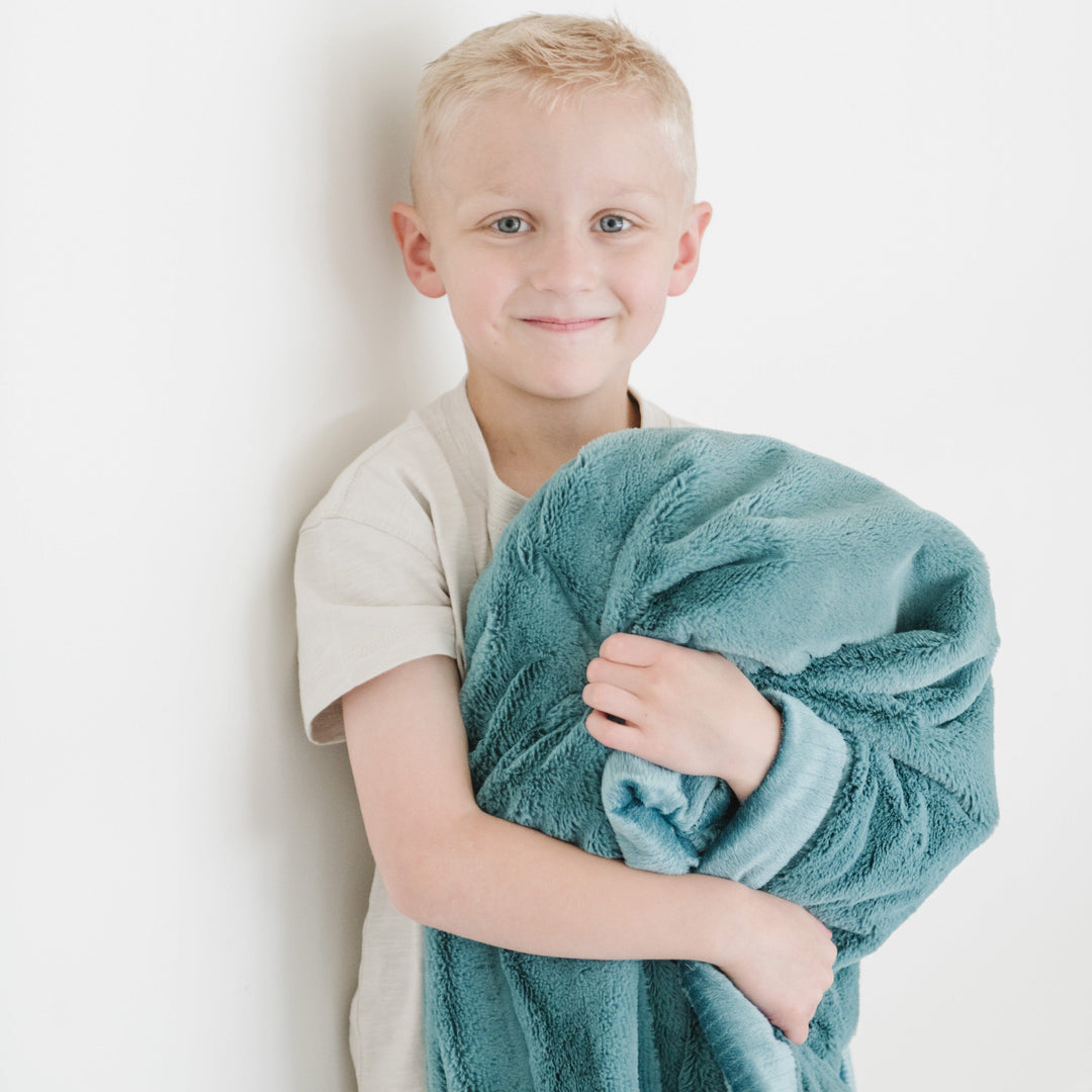 Saranoni Lush Toddler Blanket in Mineral Blue provides plush comfort as a best blanket for toddler use.
