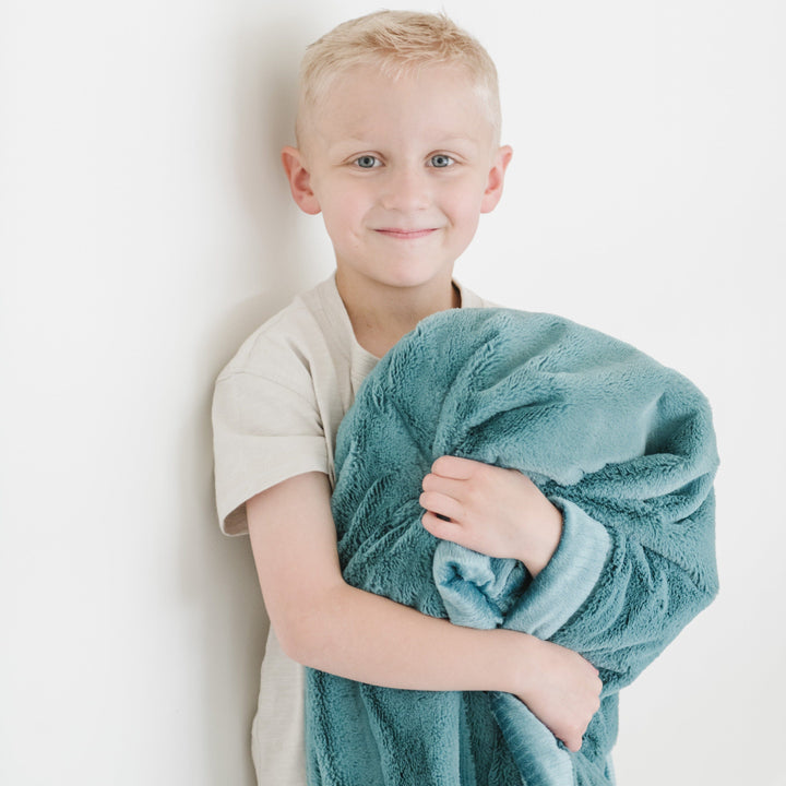 Saranoni Lush Toddler Blanket in Mineral Blue provides plush comfort as a best blanket for toddler use.