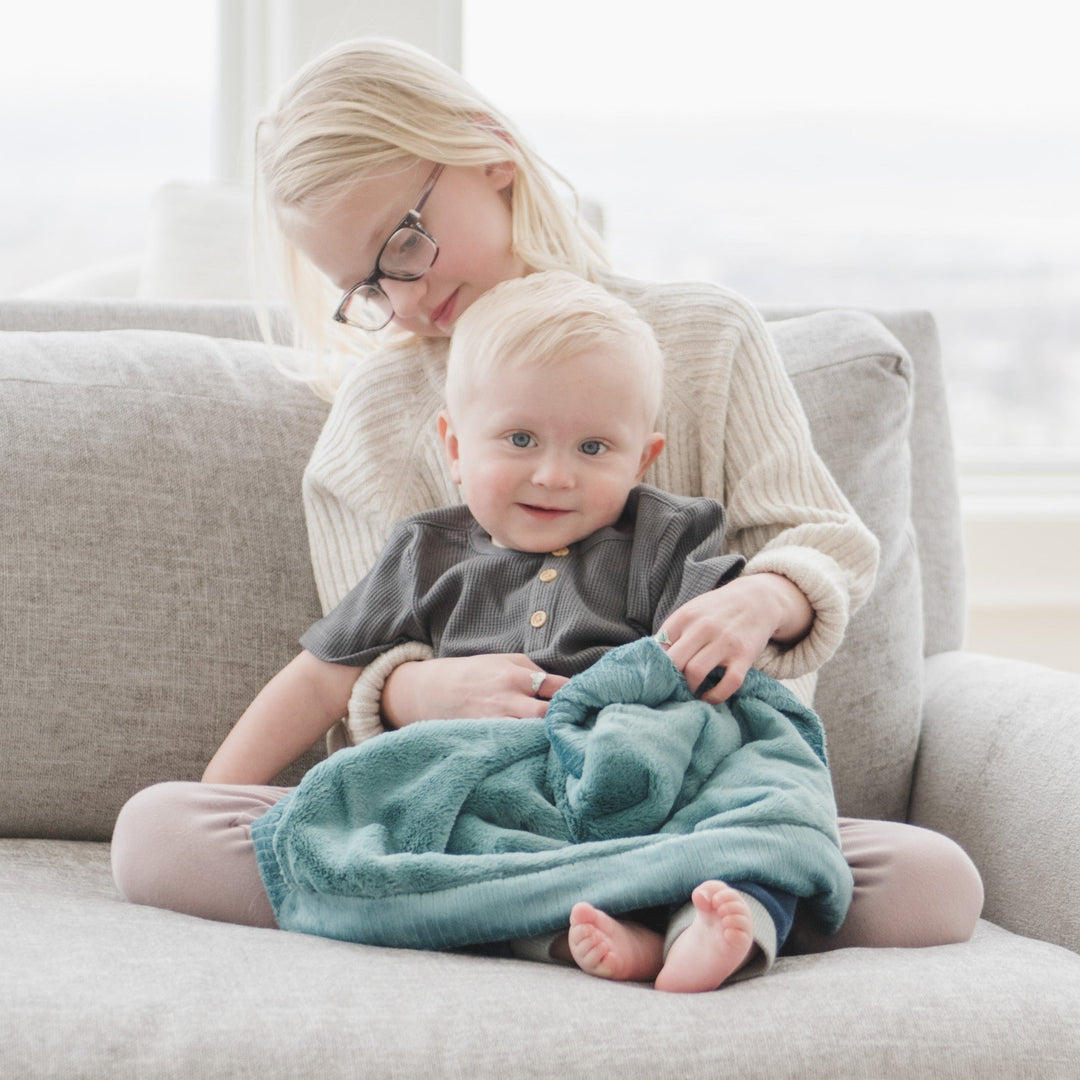 The Saranoni Lush Mini Blanket Mineral Blue stands out as a best baby blanket pick thanks to its dreamy velvety texture.