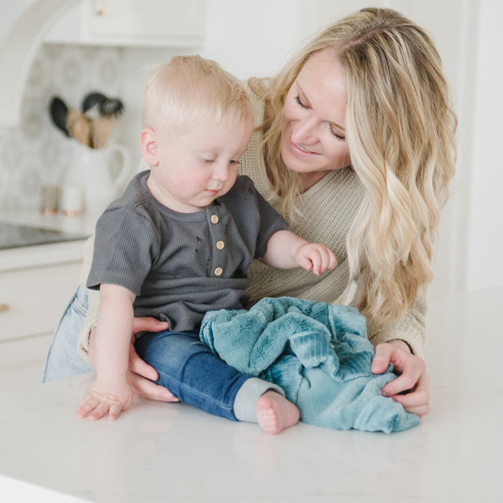 In Mineral Blue, the Saranoni Lush Mini Blanket makes an amazing choice for cozy baby boy blankets gifts.
