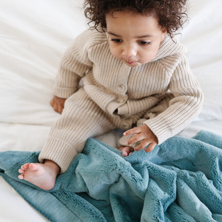 Keep your little one snug with Mineral Blue Saranoni Lush Receiving Blanket, a plush newborn receiving blanket.