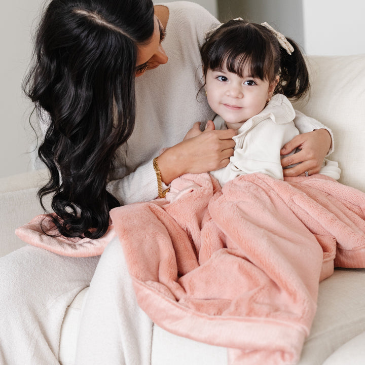 Wrap toddlers in Blossom Saranoni Lush Receiving Blanket, perfect as best toddler blankets for nap time.