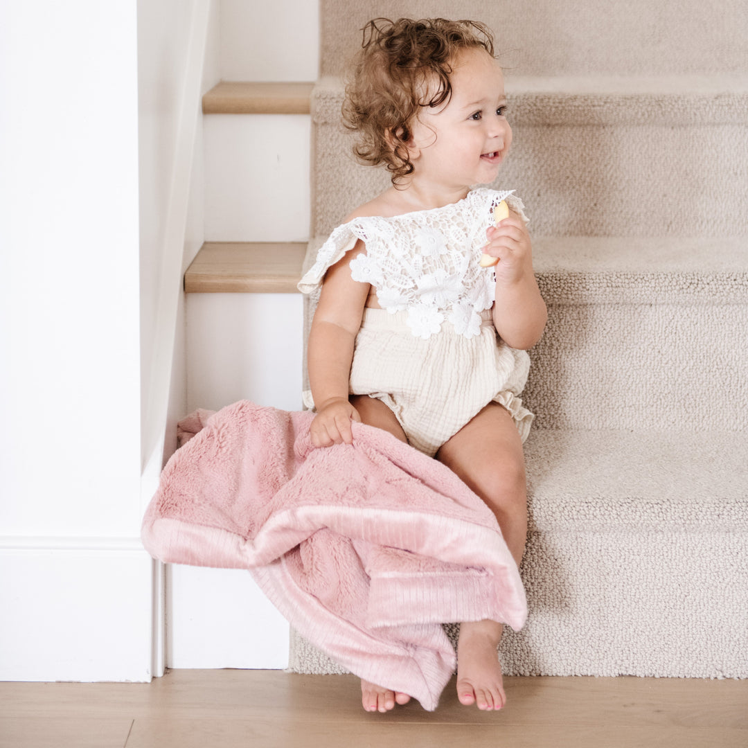 Saranoni Lush Mini Blanket in Ballet Slipper feels ultra cozy and ideal for Baby boy blankets all year long.
