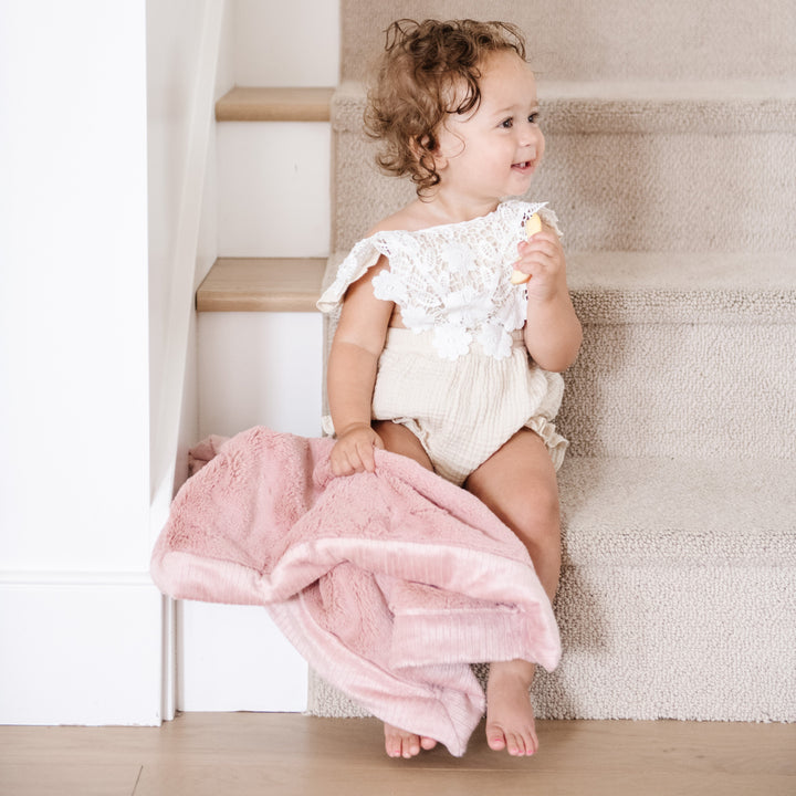 Saranoni Lush Mini Blanket in Ballet Slipper feels ultra cozy and ideal for Baby boy blankets all year long.