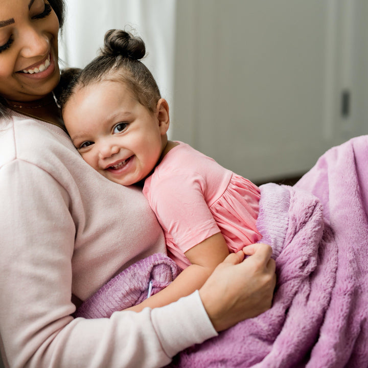 Little ones love the Aubergine Saranoni Lush Receiving Blanket, soft and gentle as baby girl blankets.