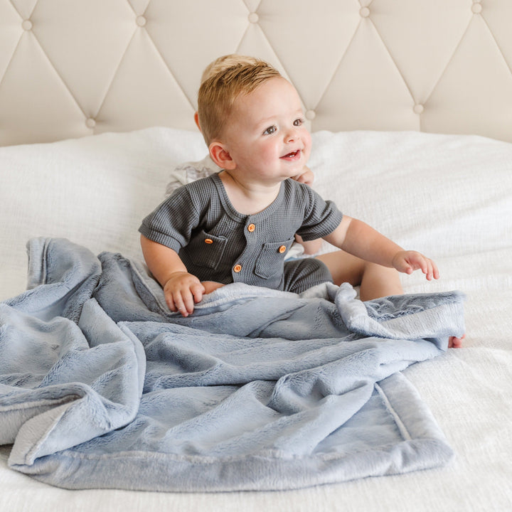 The Storm Cloud Saranoni Lush Receiving Blanket is lightweight, perfect for travel as soft baby blankets.