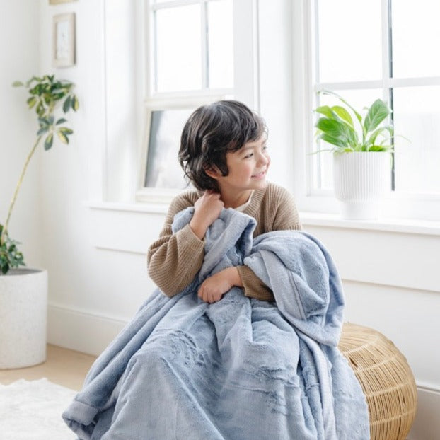 Wrap newborns in the Storm Cloud Lush Receiving Blanket by Saranoni, soft and warm as a baby boy blanket.