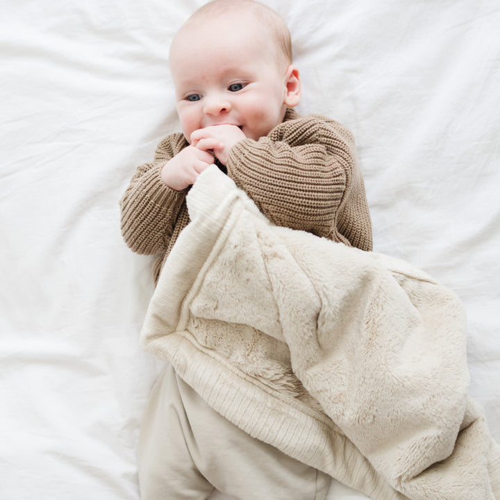 Looking for a cloud-soft touch? Buttermilk of the Saranoni Lush Mini Blanket is the baby blanket essential.