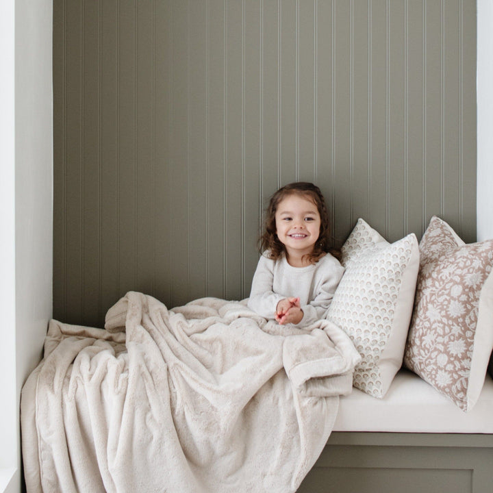Bring cozy style to any room with the Saranoni Lush Toddler Blanket in Buttermilk, perfect as a soft baby blankets option.