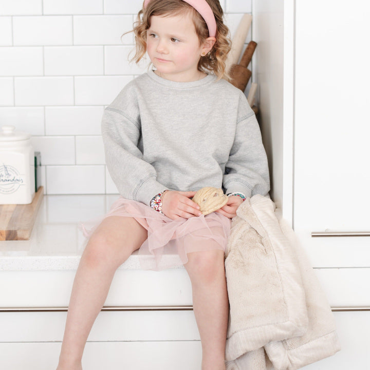 Wrap little ones in Buttermilk Saranoni Lush Receiving Blanket, warm and plush as infant receiving blankets.