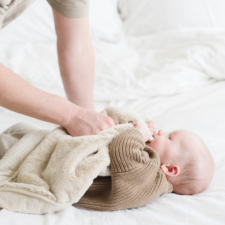 Buttermilk Saranoni Lush Mini Blanket adds buttery plushness that delivers consistent comfort in baby blankets.