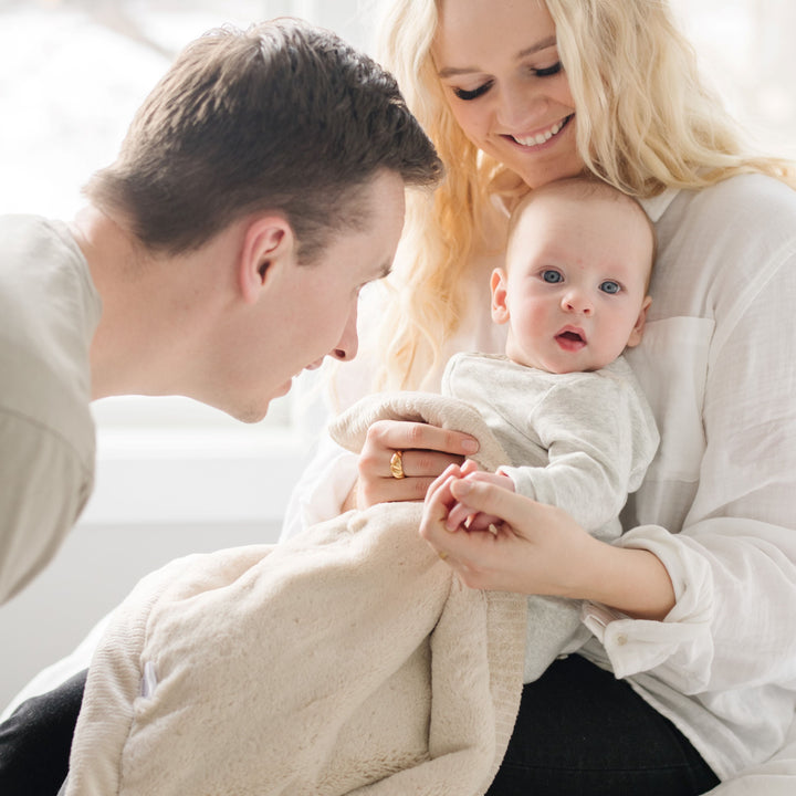 The Buttermilk Saranoni Lush Receiving Blanket keeps babies comfortable, perfect as a newborn receiving blanket.