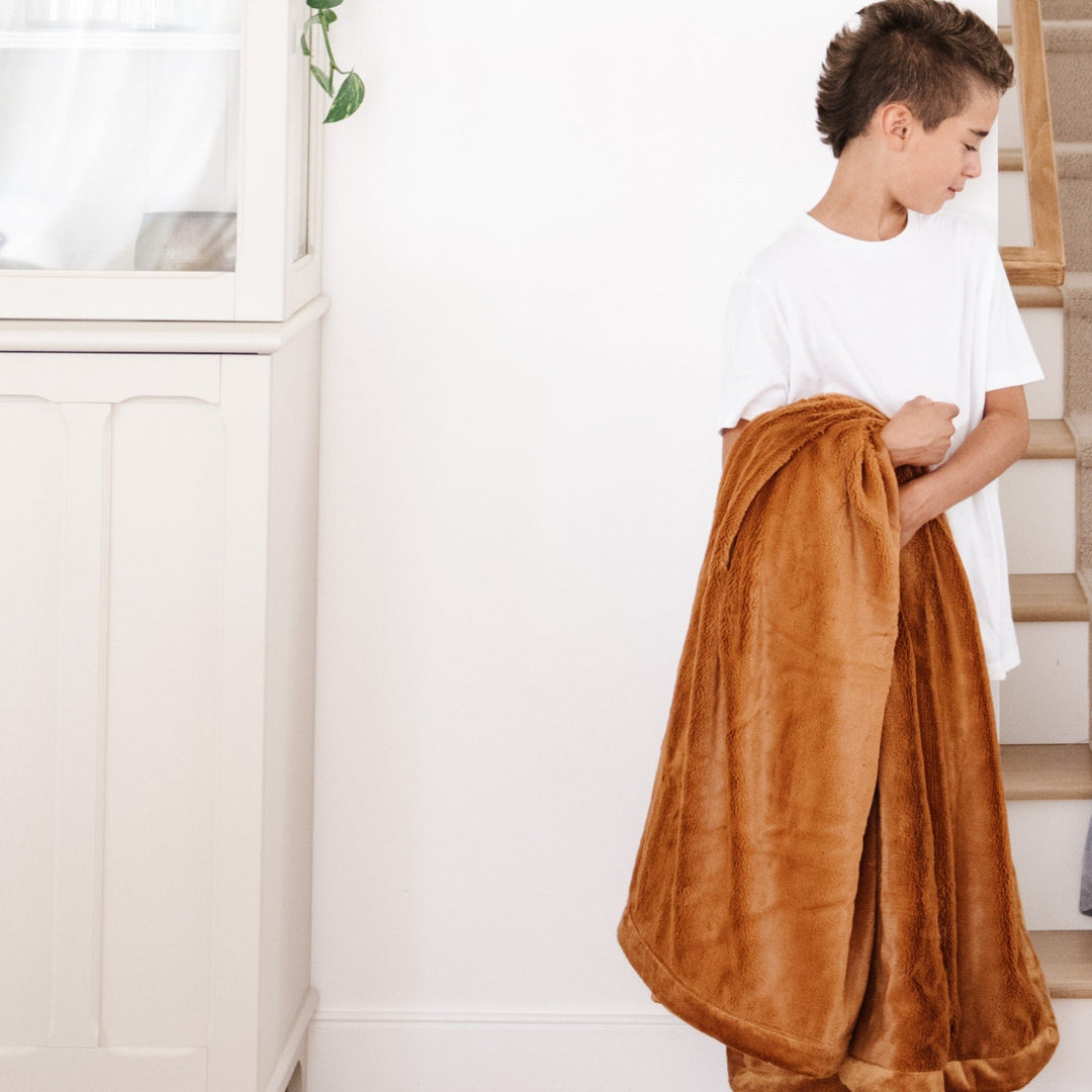 The Saranoni Lush Toddler Blanket in Camel is a go-to comfort essential, ranking high among best toddler blankets.