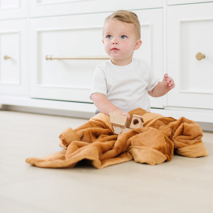 Cuddle moments are perfect with Camel Lush Receiving Blanket from Saranoni, soft as a baby blanket.