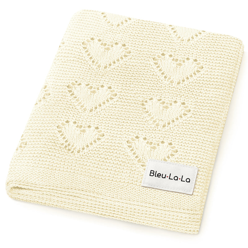 Bleu La La 100% Cotton Luxury Knit Heart Swaddle Baby Blanket in cream, neatly folded with soft open-weave knit texture.