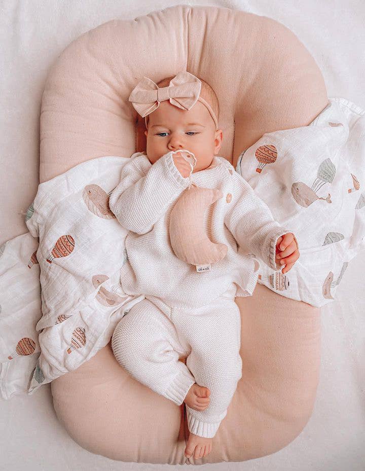Ali+Oli bamboo muslin whale swaddle blanket used with newborn baby soft breathable swaddle for sleep comfort and nursery essentials