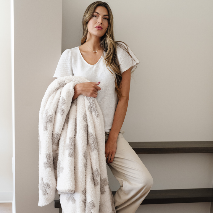 SaranoniÕs Double-Layer BAMONI¨ Throw Blanket in Swiss Cross pairs modern style with plush comfort, easily one of the best baby blankets available.