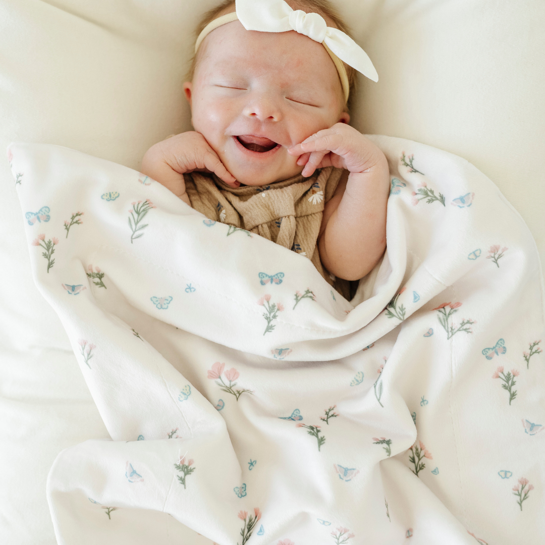 Saranoni Minky Stretch Receiving Blanket in Secret Garden wraps your baby in gentle softness, a must-have newborn receiving blanket.