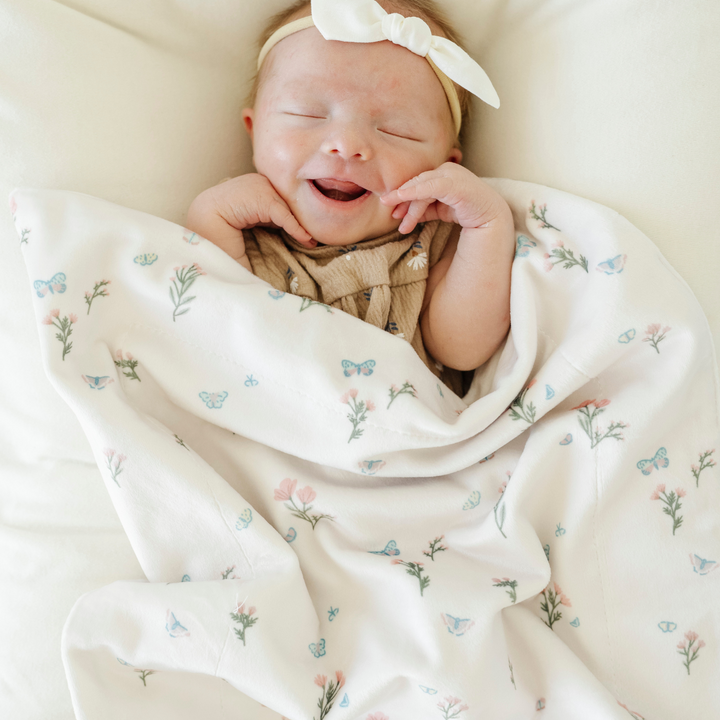 Saranoni Minky Stretch Receiving Blanket in Secret Garden wraps your baby in gentle softness, a must-have newborn receiving blanket.