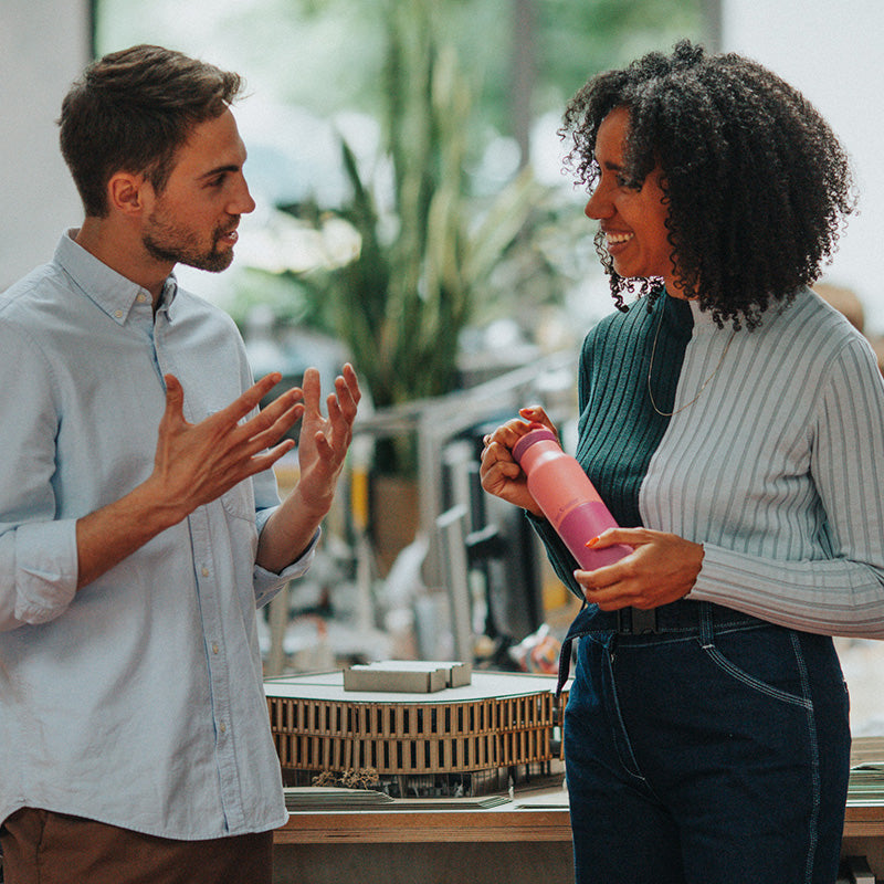Office setting with Klean Kanteen 12oz Rise Classic Black Bottle, made from recycled stainless steel and dishwasher safe for convenience.