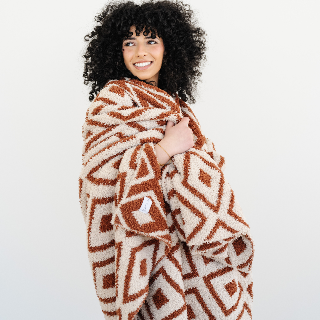 Designed for everyday snuggles, the Saranoni Double-Layer BAMONI¨ Throw Blanket in Khmer is perfect as a cozy baby boy blanket.