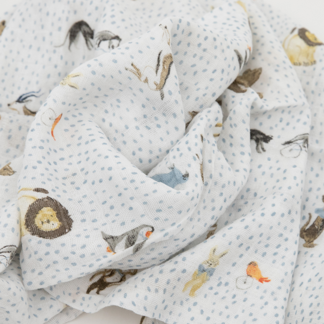 Little Unicorn Cotton Muslin Swaddle Blanket – Party Animals, breathable muslin blanket for babies.