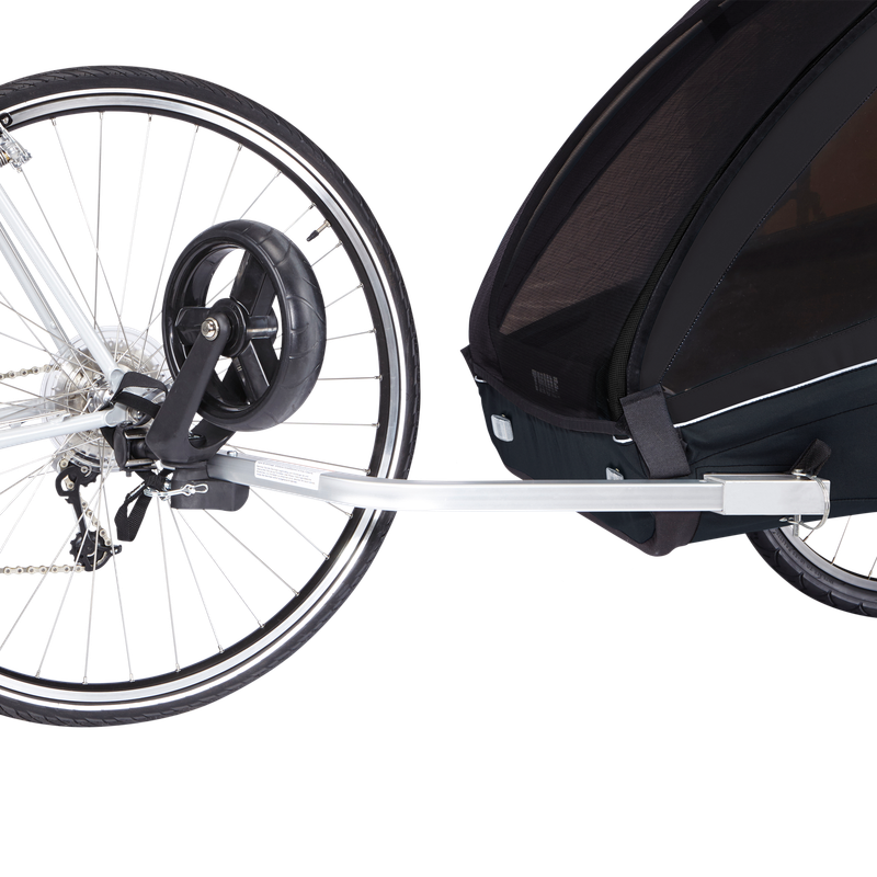 Black Thule Coaster XT bike trailer for two kids with ezHitch axle mount