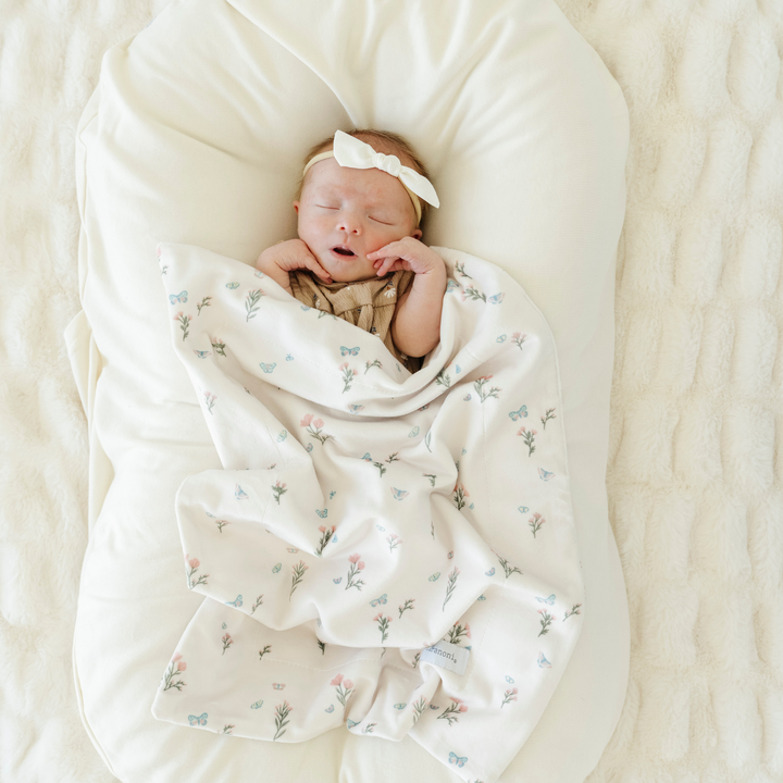 Infused with charm, the Saranoni Minky Stretch Receiving Blanket in Secret Garden makes a sweet and stylish baby boy blanket.
