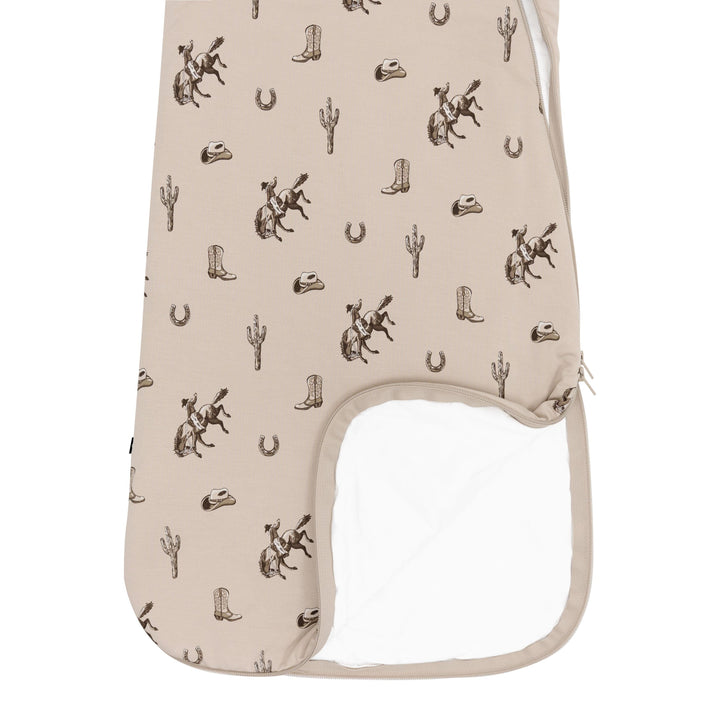 Shown laid flat, Kyte Baby Baby Sleep Sack Tog 1.0 in Classic Cowboy highlights zipper details and roomy shape ideal for a sleep sack baby