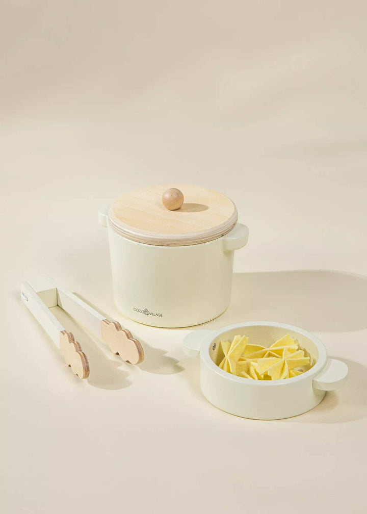 Natural-toned Coco Village Wooden Pasta Playset inspires pretend play and storytelling. A delightful Montessori toy for little learners.