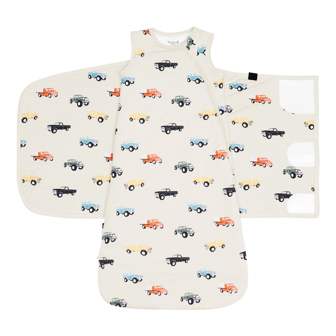 Kyte Baby Baby Sleep Sack Swaddler XS in Vintage Truck, soft bamboo design shown as a breathable sleep sack for cozy newborn rest