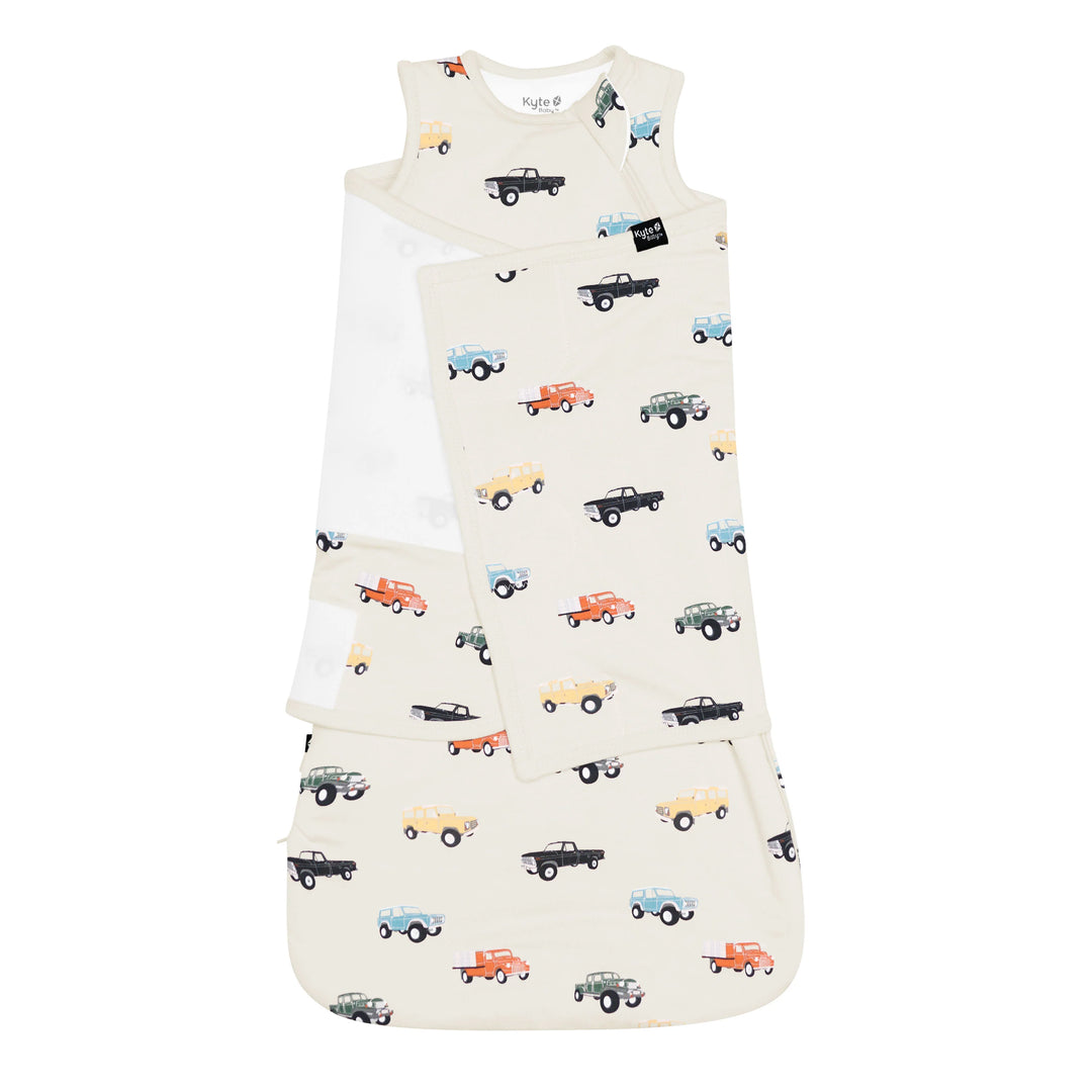 Classic truck print meets function in the Kyte Baby Baby Sleep Sack Swaddler XS in Vintage Truck, one of the most-loved sleep sacks