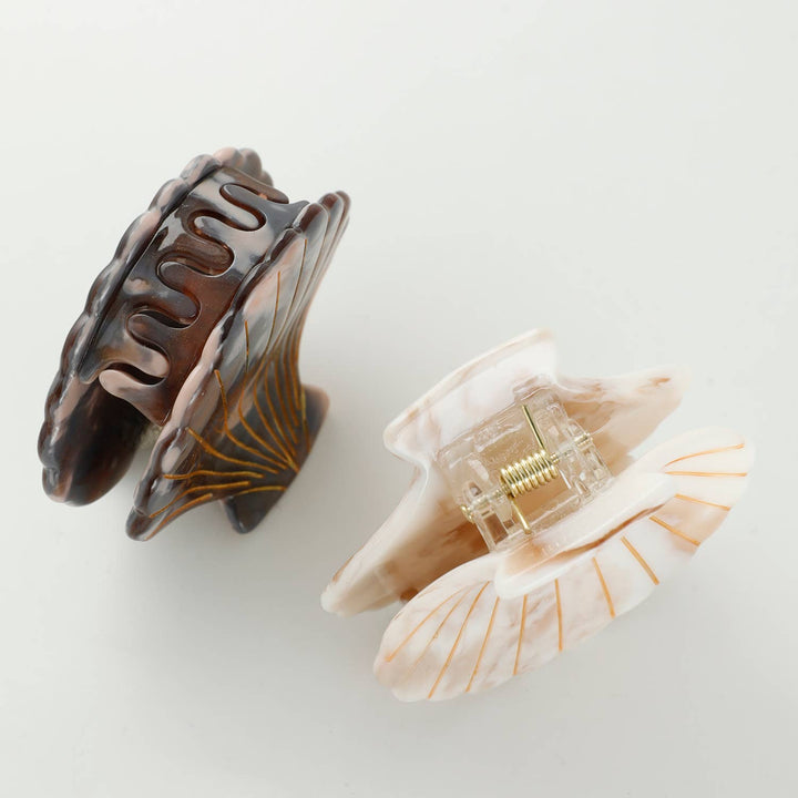 Adorro Calacatta Seashell Claw Clip Small lifestyle image styled in hair showing small 2 inch seashell clip holding a half-up hairstyle