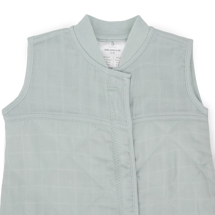 Close-up of Little Unicorn Cotton Muslin Quilted Sleep Bag - Sea Salt, breathable fabric ideal as a baby sleeping bag.